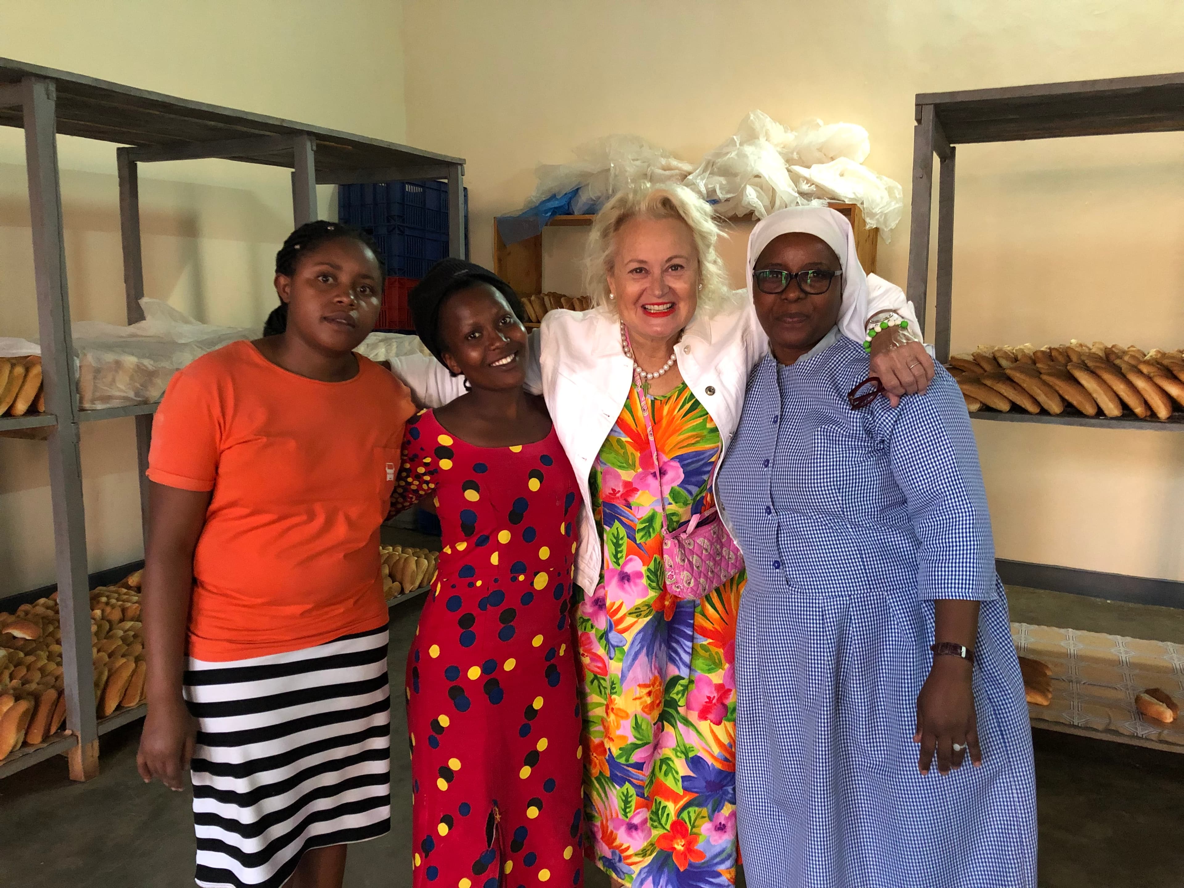 Carolina with bakery team members in Rwanda